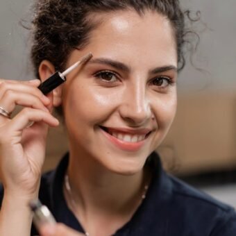 woman applying tres chic vegan eyebrow gel